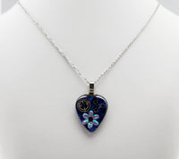 Blue Guitar Pick Pendant encased in Epoxy with Flowers and watch gears.  One of a kind