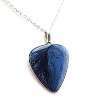 Guitar Pick Pendant painted with a blue and black galaxy
