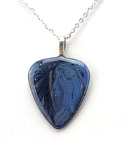 Guitar Pick Pendant painted with a blue and black galaxy