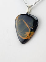 Bengals inspired orange and black painted guitar pick pendant.  One of a Kind