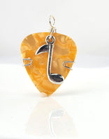 Orange Guitar Pick pendant with silver music note charm.