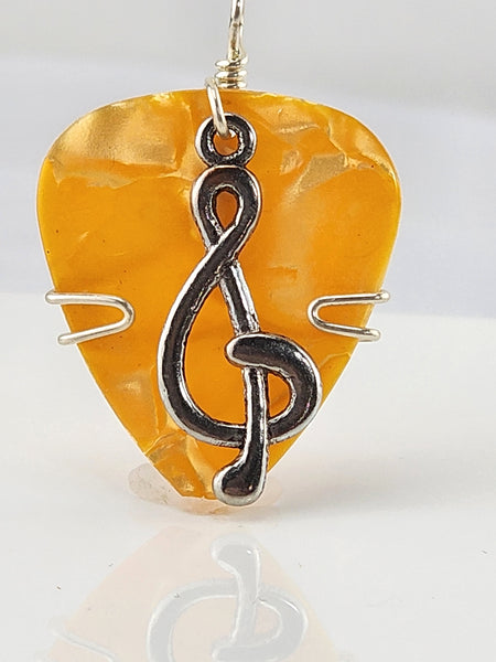 Orange Guitar Pick pendant with silver Treble Clef charm.