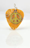 Orange Guitar Pick pendant with yellow peace sign charm.