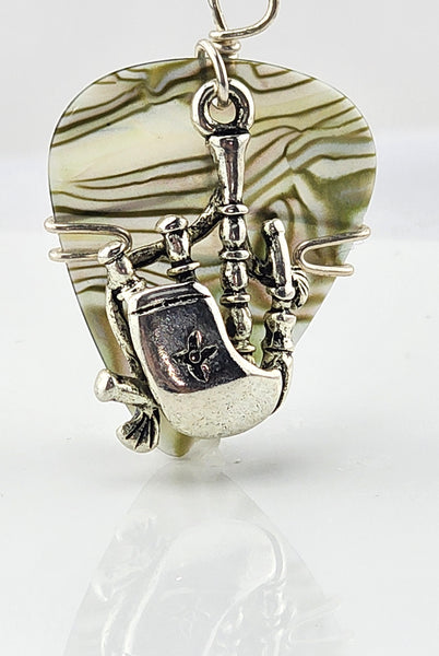 Abalone look guitar pick pendant with silver bag pipes charm