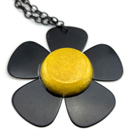 Daisy Guitar Pick Necklace - Five Black Guitar Picks with Yellow center to create a daisy flower necklace.  Black metal chain included