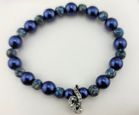 Treble Clef Stretchy Bracelet made of Reconstructed Blue shell and Blue Crystazzi Pearls.