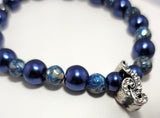 Treble Clef Stretchy Bracelet made of Reconstructed Blue shell and Blue Crystazzi Pearls.